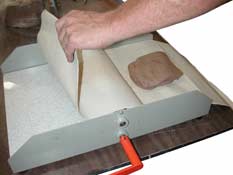 Blue Heron Mini Roller - clay before going through the roller